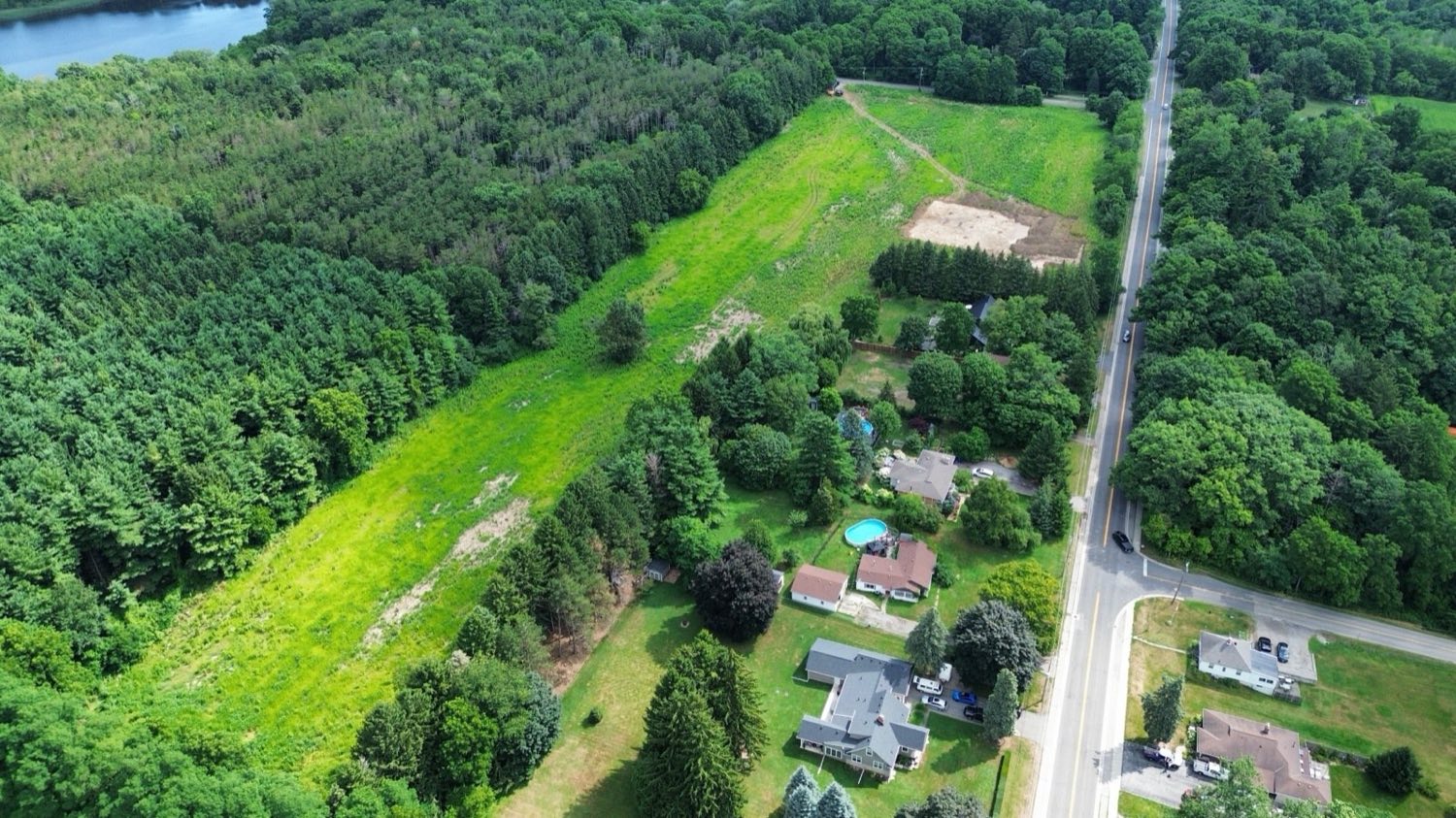 Aerial view of the Greensville property in Flamborough, fields and woodland on the Niagara Escarpment